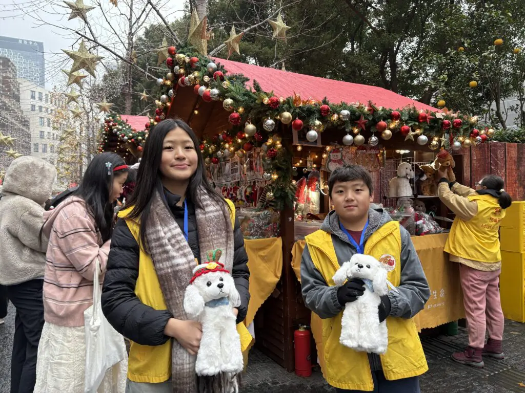 Grace and Joshua Yu as Volunteers at Christmas market