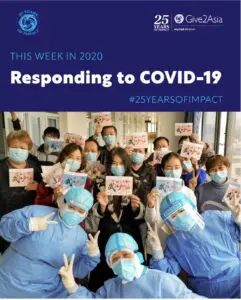 medical workers with masks holding up thank you cards